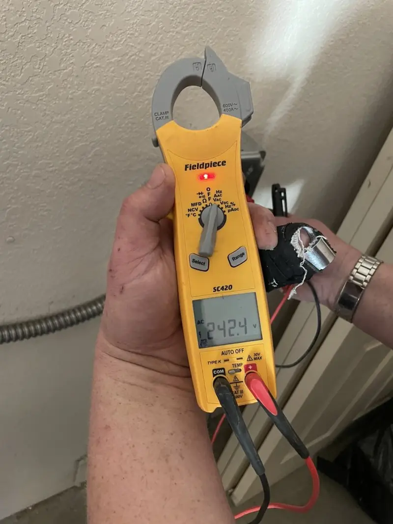 Voltage testing with clamp meter during Ceiling Fan Installation in Hutchinson Island South